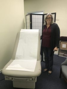 Project HELP executive director Eileen Wesley with new ADA-approved bed